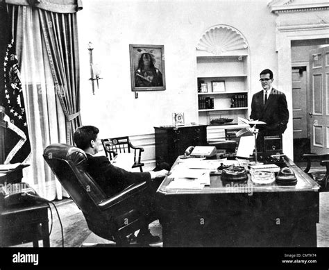 John F Kennedy Us President In The White House Oval Office With Adviser