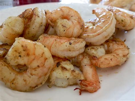 In a small saucepan, add 2 pressed garlic cloves and butter. Easy Marinated Grilled Shrimp