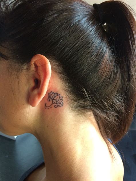 Lotus Flower Behind The Ear Tattoo