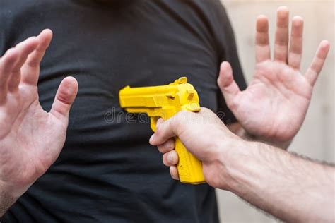 Gun Disarm Self Defense Techniques Against A Gun Point Stock Photo