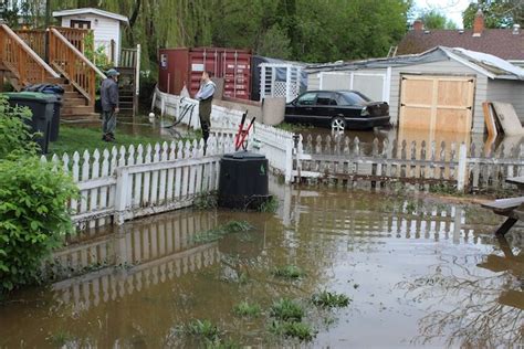 Update Kelownas Mill Creek Spills Over Its Bank Flooding Apartment Building Houses
