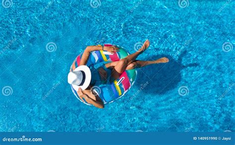Beautiful Girl In Hat In Swimming Pool Aerial Top View From Above