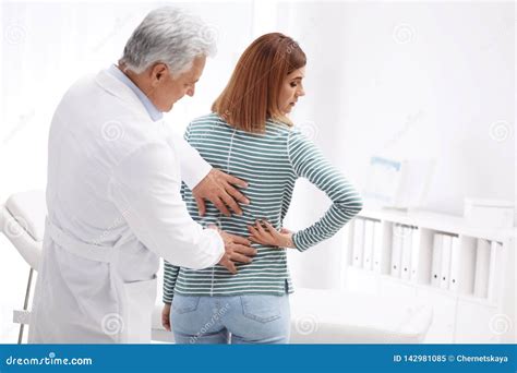 Chiropractor Examining Patient With Back Pain Stock Image Image Of