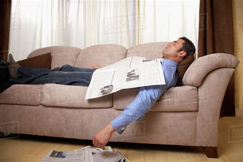 Hispanic Man Sleeping On Sofa Stock Photo Dissolve