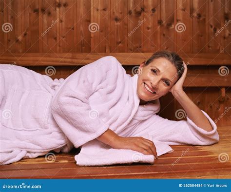 Simmering Down In The Sauna A Mature Woman In A Sauna Stock Photo