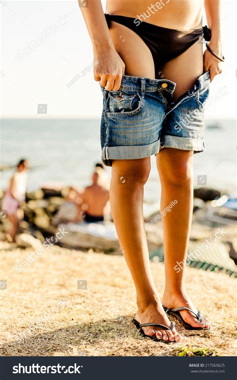 Woman Undressing On Beach Stock Photo Shutterstock