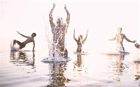 Premium Photo Friends Splashing Water