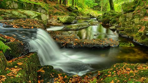 Waterfall In Rocky Autumn Forest
