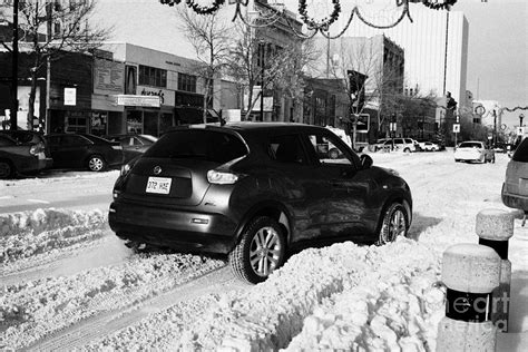 Car Stuck In Deep Snow On Downtown City Street Saskatoon