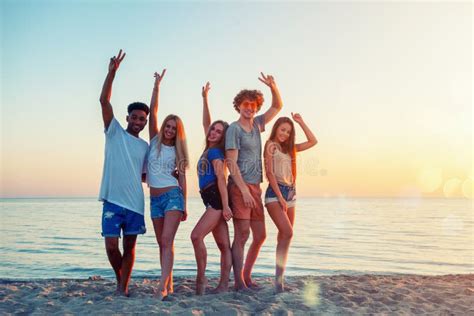 Group Of Friends Having Fun On The Beach Concept Of Summertime Stock