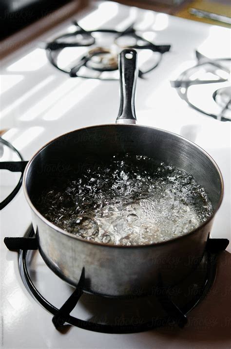 Pot Of Water Boiling On A Gas Stove By Stocksy Contributor Cara