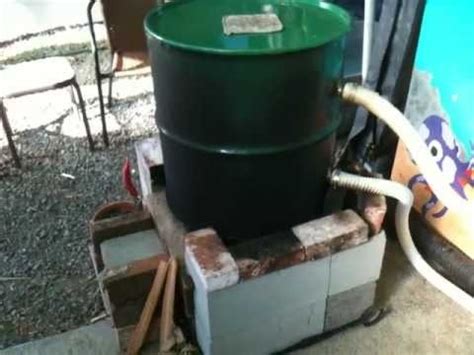Connect the to hose the swimming pool pump return. now this homemade rocket stove heats a pool. black hose in ...
