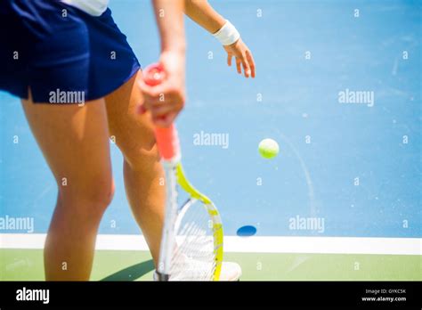 Beautiful Female Tennis Player Serving Outdoor Stock Photo Alamy