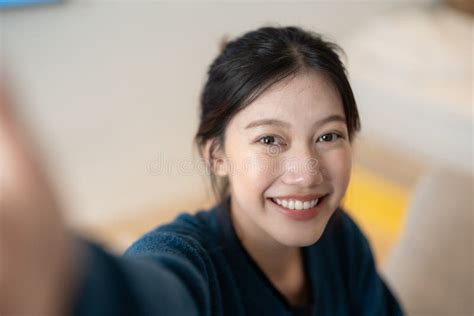 Image Of Attractive Young Asian Woman Make Selfie By Camera At Her Home