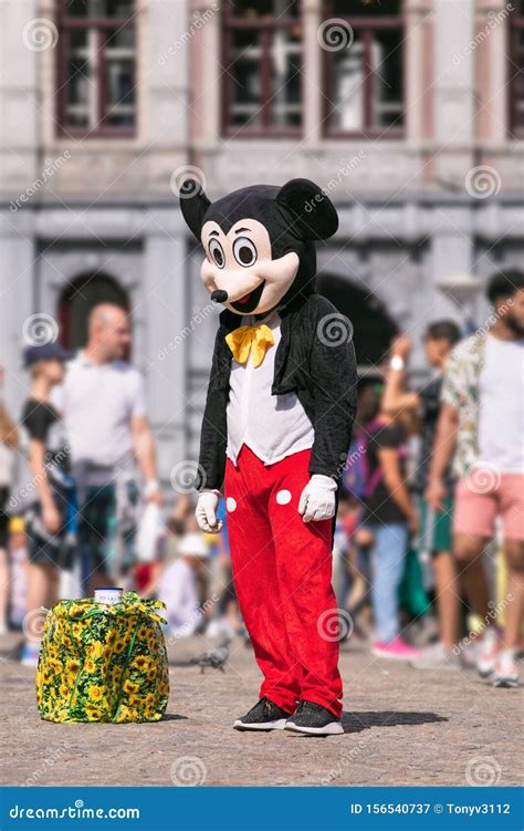 Street Entertainer Dressed Like Micky Mouse On A Sunny Dam Square