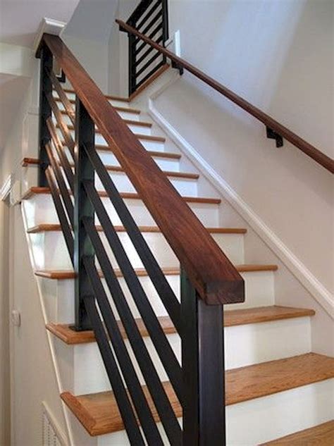 An Image Of A Stair Case With Wood Handrails And Metal Railing On The