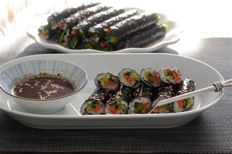 Place the seaweed sheets onto the bamboo sheet and spread a layer of the sushi rice onto the seaweed. Mini Seaweed Rice Rolls (Mayak Gimbap) - Beyond Kimchee