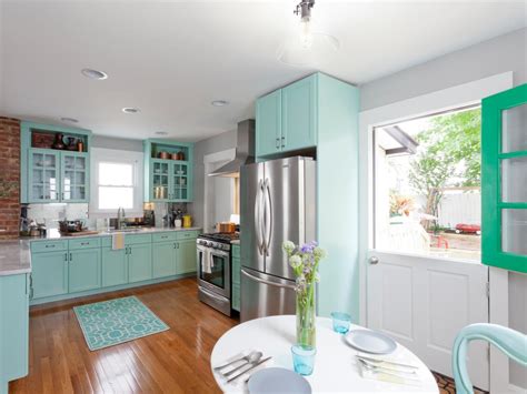 When i tire of this teal, i'll try the light blue. Bright Modern Kitchen with Teal Cabinets and Dutch Door | HGTV