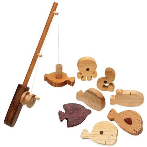 A Wooden Toy Fishing Set With Fish Rod And Other Items To Make It Look