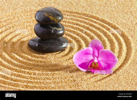 Japanese Zen Garden With Stacked Stones In Sand Stock Photo Alamy