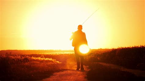 Fisherman Walking At Sunset Sky Background Stock Footage Sbv 323907261