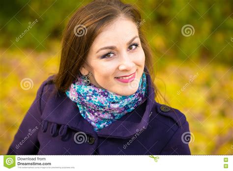Portrait Of A Smiling Beautiful Girl On Blurry Background