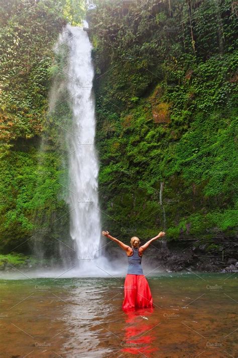 Woman Under Waterfall