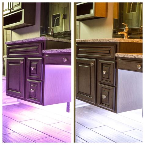 Over a window and between two cabinets, via sew woodsy: Floating cabinets, adjustable under-cabinet lighting, wood-look vertical tile, and black and ...