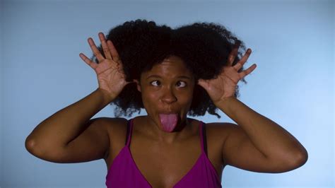 Black Woman Wagging Fingers Stick Out Tongue Make Funny Face To Camera