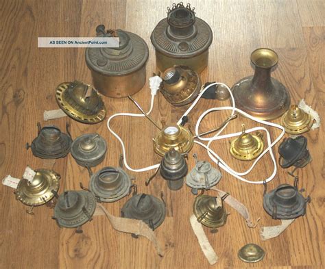 An Assortment Of Antique Brass Items On A Wooden Floor