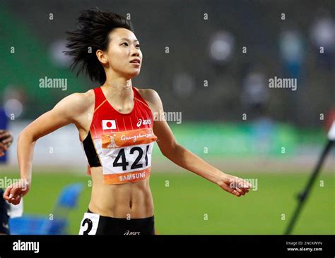 japan s chisato fukushima looks at the scoreboard after winning the women s 200m event at the