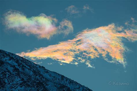 Stunning Iridescent Clouds Captured In Rare Sighting On Siberian Peak