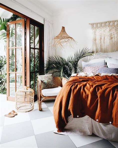 With shades to set any vibe, this lively color is the perfect home refresher. burnt orange bedspread, tropical mini palm #bedroom # ...