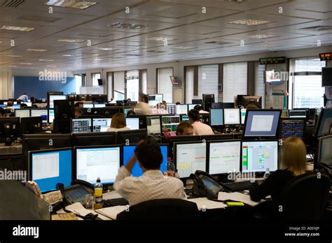 Trading Floor In City Of London Traders Working On Computers On Stock