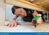Woman Finding Home Keys Under the Bed Stock Photo - Image of keys ...