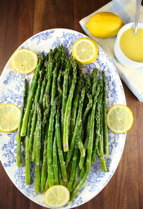 Arrange potatoes and unpeeled garlic cloves in a large roasting dish. Roasted Garlic Asparagus with Lemon Sauce - Miss in the ...