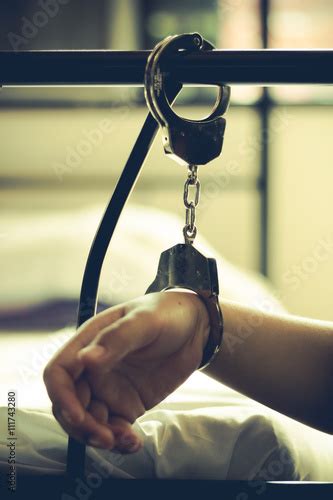 Lady With Handcuff On Bed Human Trafficking Concept Photo Stock