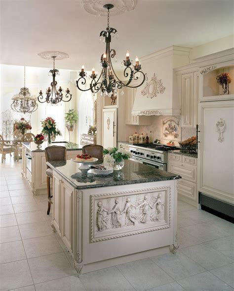 White Victorian Kitchen With Relief Island With Grey Marble Top White