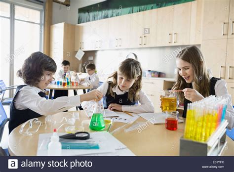 School Girls Conducting Experiment In Science Classroom Stock Photo Alamy