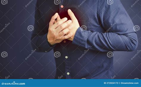 Man Suffering From Chest Pain Hand Pressing On Chest With Painful