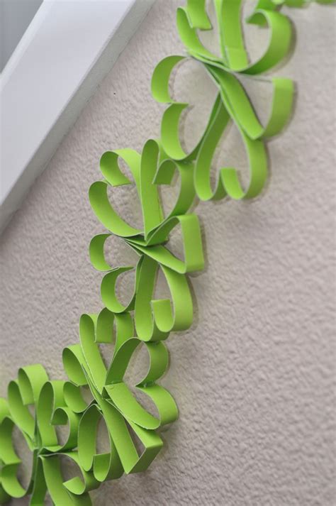 I totally love those cute shamrock dinner plates! Make Your Own Paper Shamrock Garland - Sippy Cup Mom