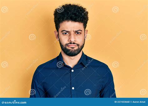 Young Arab Man With Beard Wearing Casual Shirt Depressed And Worry For