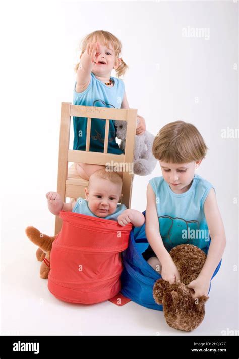 Three Siblings Playing Together Stock Photo Alamy