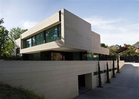 Modern Home Made Of Limestone And Black Glass Design Milk