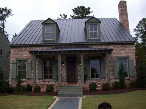 It's a nice touch because brick isn't all one solid color either. gray craftsman house with metal roof | Metal roof houses ...