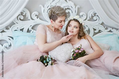 Lesbian Honeymoon Newlyweds In Light Pink Bridal Dresses Lying On A