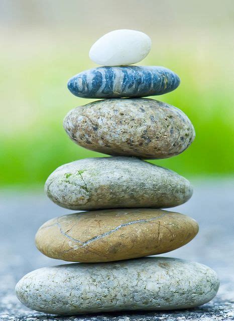 Stones Smoothed By Countless Waves Form A Perfectly Balanced Zen Tower