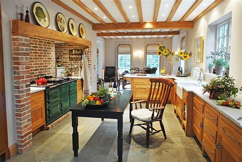 English Kitchen With Green Aga Farmhouse Sink And Slate Floors
