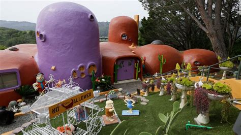 Flintstone House Can Keep Its Cartoon Statues Thanks To A Settlement