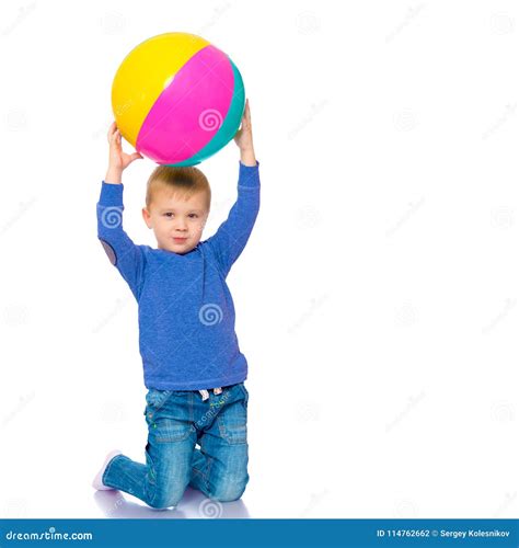 A Little Boy Is Playing With A Ball Stock Photo Image Of Play Ball